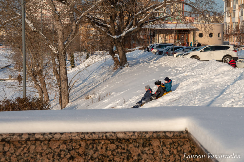 Kids sledding in the snow in Omsk