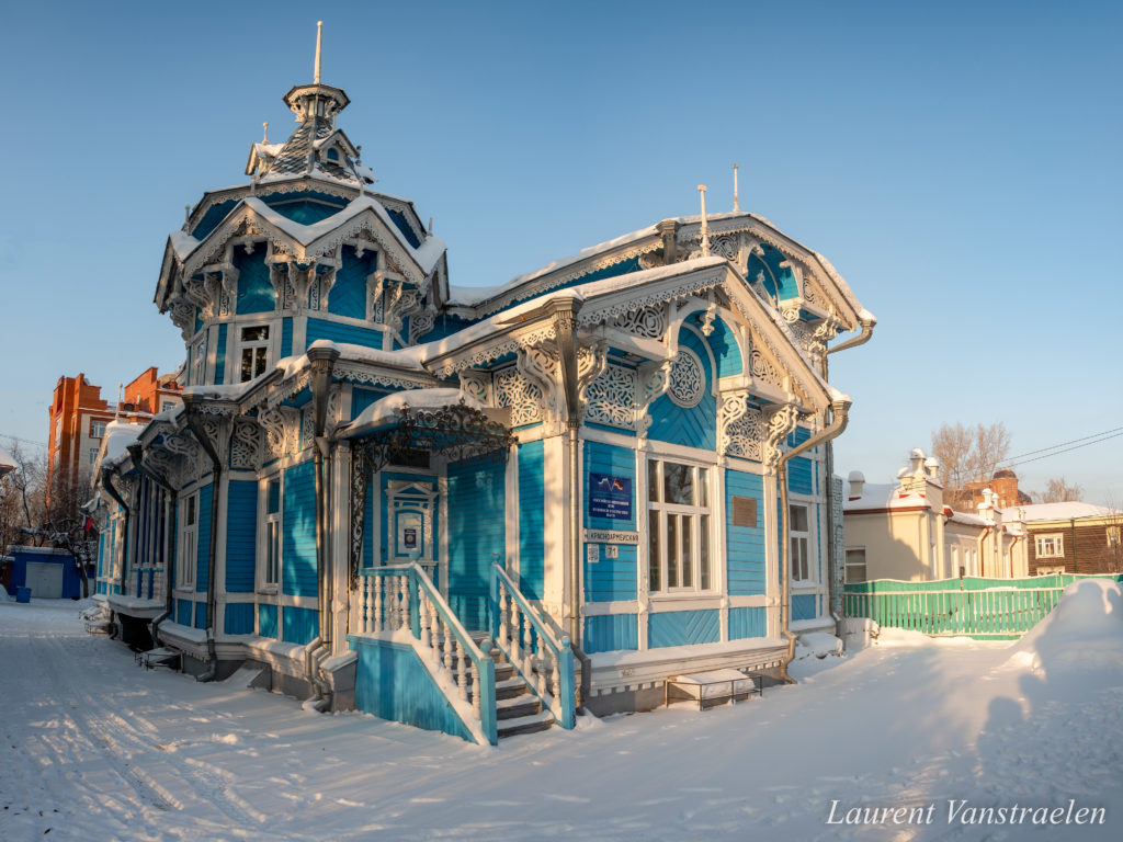 The blue wooden house in Tomsk in winter.